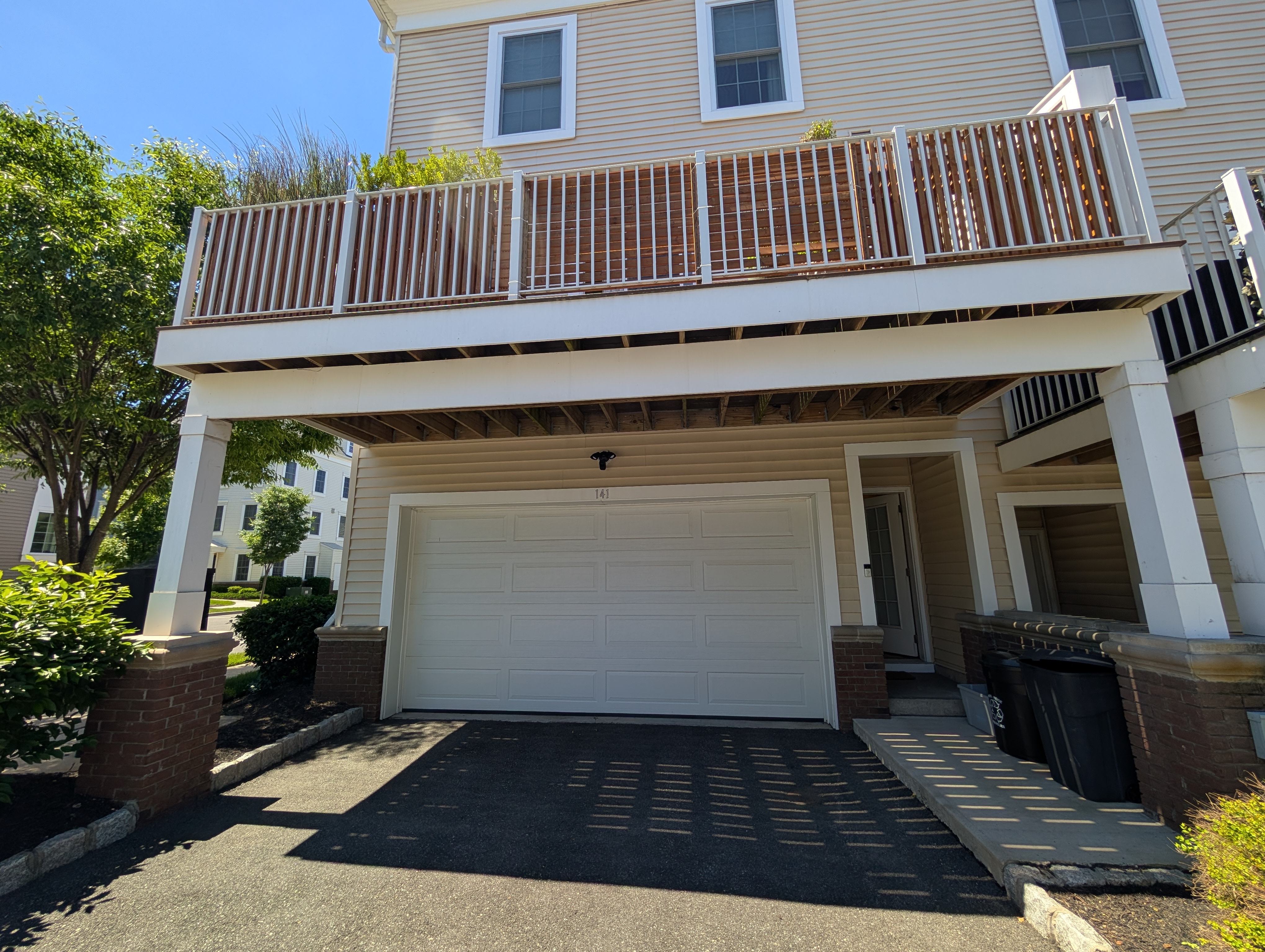 Full exterior with deck